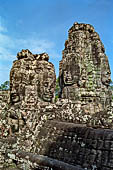 Angkor Thom - Bayon temple, second enclosure, corner towers seen from the central terrace 